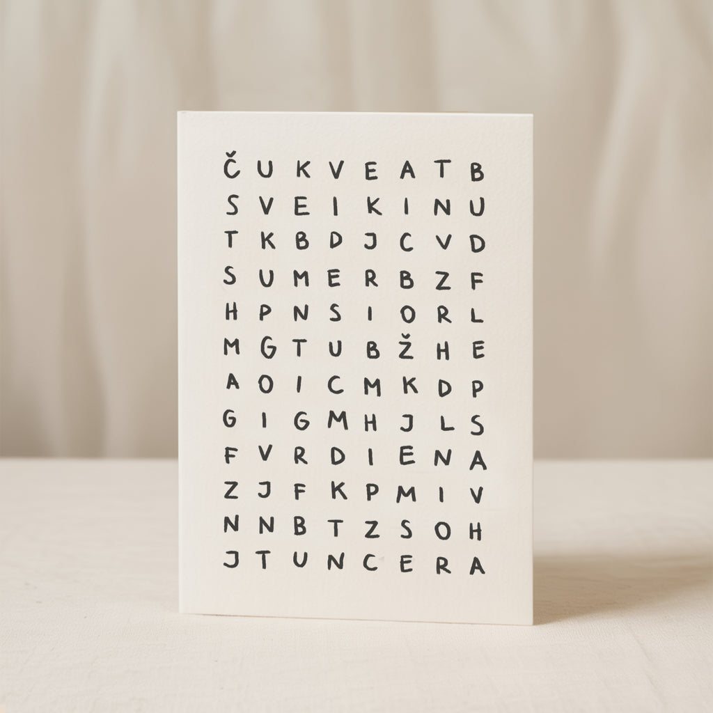 Minimalist birthday greeting card featuring a crossword-style letter puzzle with the hidden message “Sveikinu su gimimo diena” on a white background.