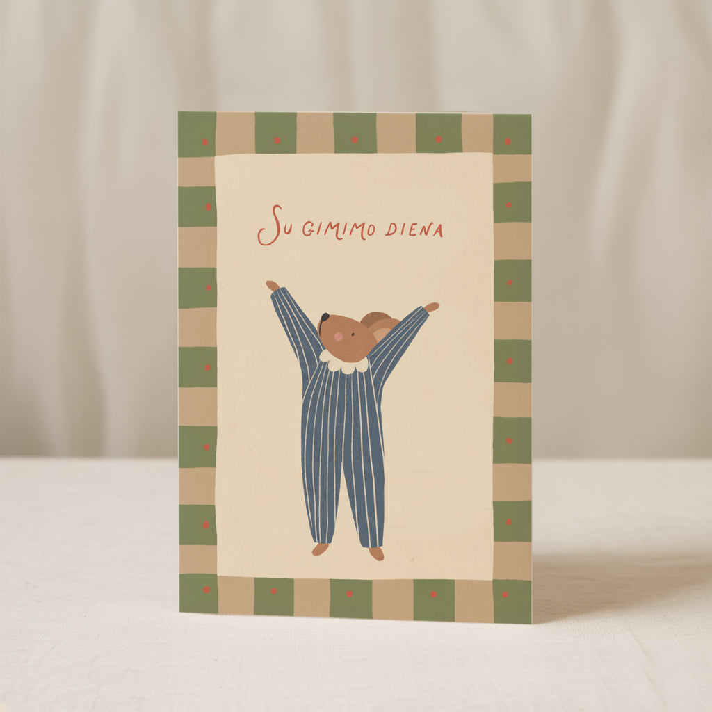 Birthday greeting card featuring a cute mouse with raised arms holding a “Su gimimo diena” sign, whimsical and cheerful birthday card design.