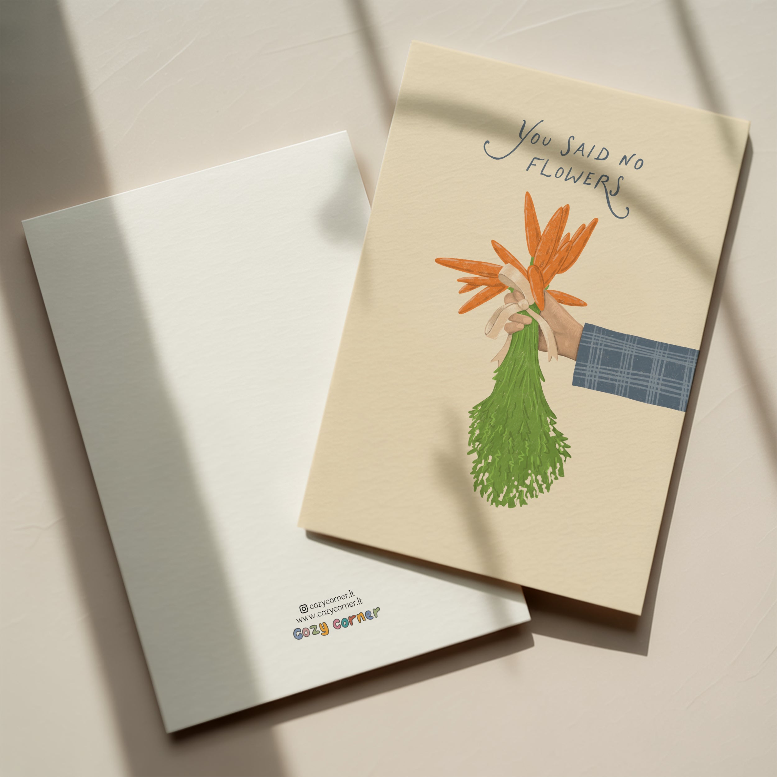 Funny wedding greeting card showing a hand holding a bouquet of carrots instead of flowers with the text “You said no flowers”, humorous minimalist wedding design.