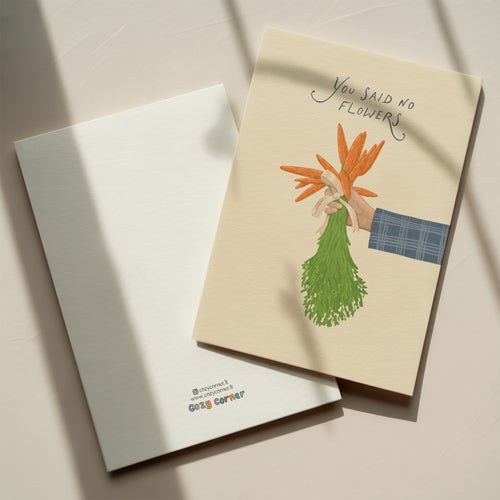 Funny wedding greeting card showing a hand holding a bouquet of carrots instead of flowers with the text “You said no flowers”, humorous minimalist wedding design.