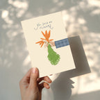 Funny wedding greeting card showing a hand holding a bouquet of carrots instead of flowers with the text “You said no flowers”, humorous minimalist wedding design.