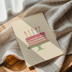 Funny birthday greeting card featuring an illustrated cake with candles and the word "KIEK?" instead of candle flames, humorous minimalist birthday design.