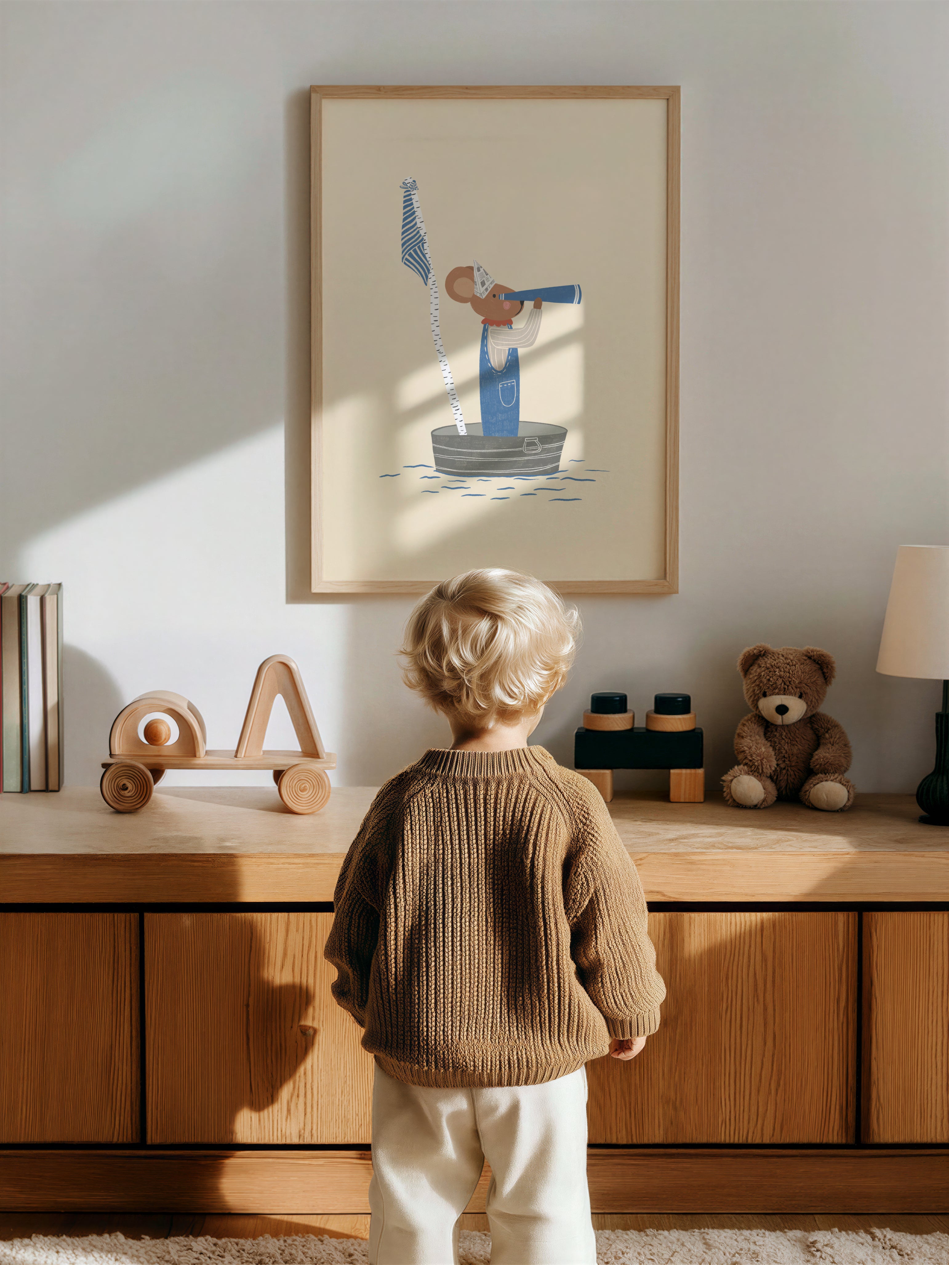 Whimsical nursery wall art featuring a little mouse standing in a handmade toy boat, wearing a paper hat and looking through binoculars toward the horizon, adventure-themed children's illustration.