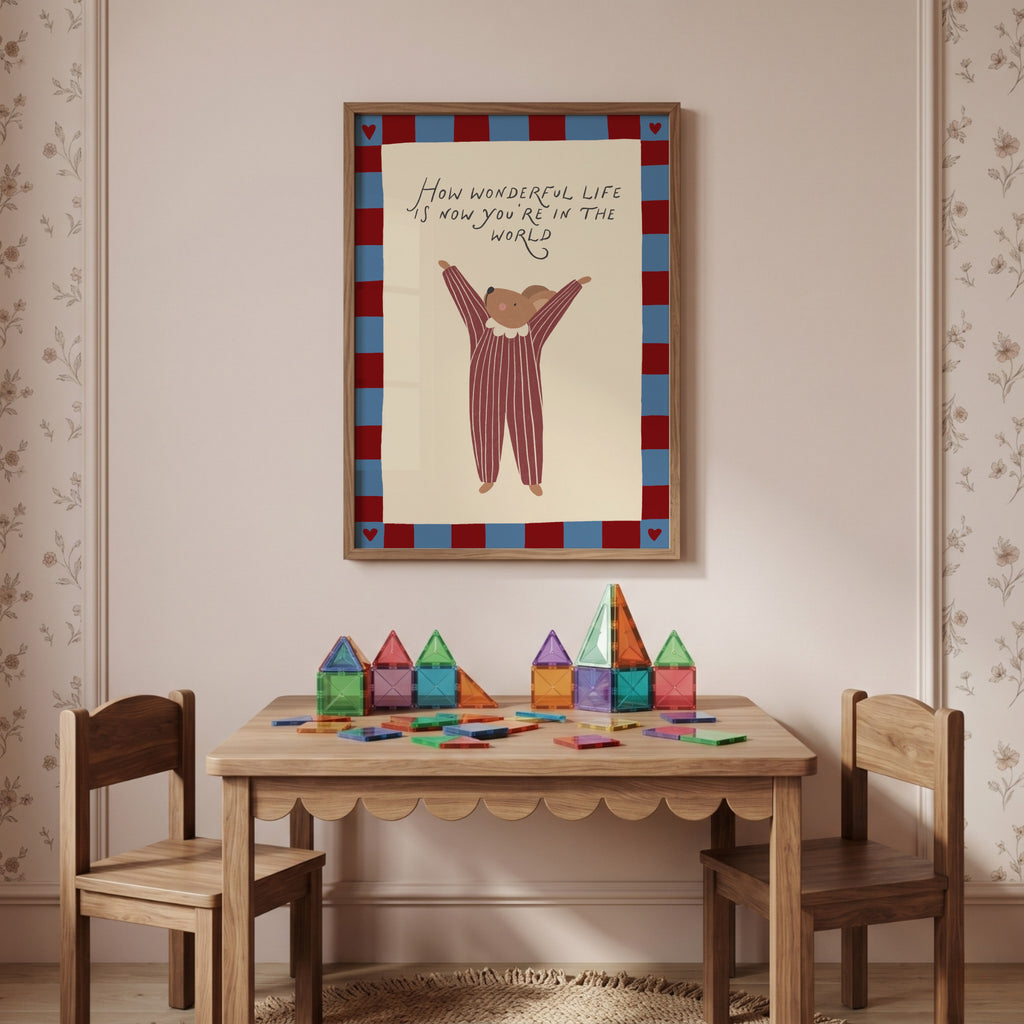 Cute storybook mouse wearing a striped outfit, standing with arms raised and pointing toward the quote "How wonderful life is now you're in the world". Beige background with a blue and burgundy gingham-style border, printable nursery wall art.