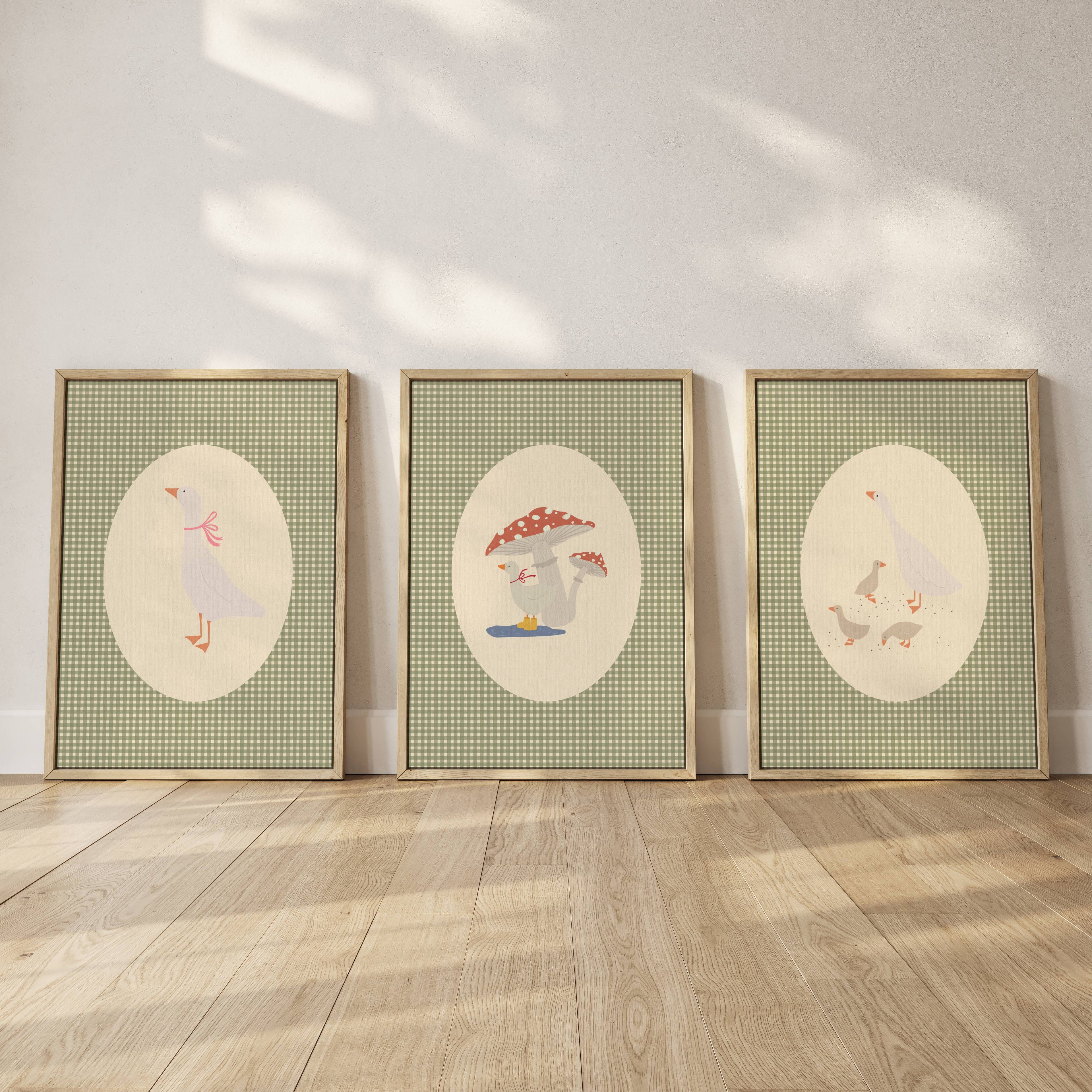 Set of three matching children’s posters featuring cute duck illustrations in oval frames on a green gingham background, in a soft classic style