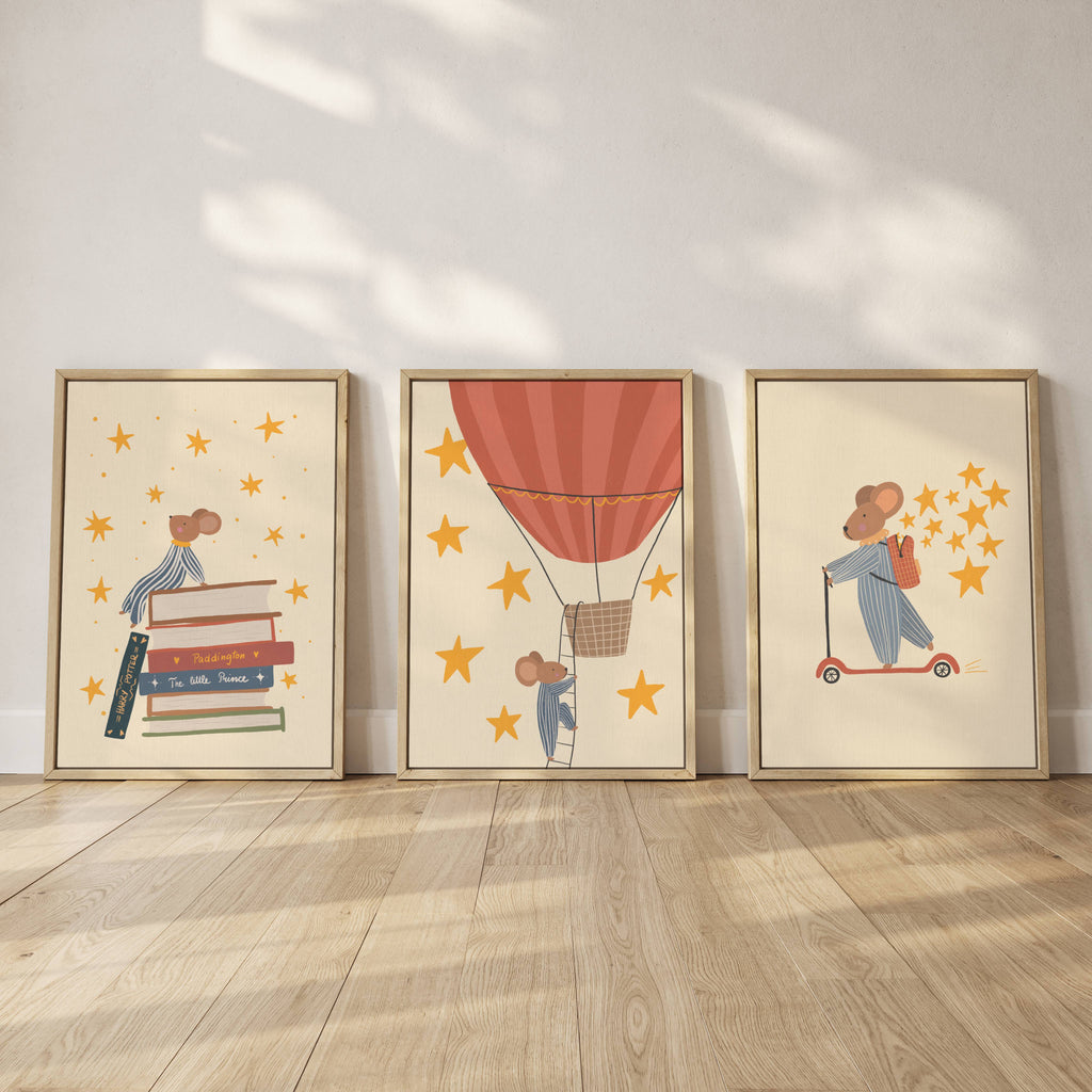 Storybook mouse wall art set featuring a mouse on a scooter, a mouse sitting on books, and a mouse in a hot air balloon with starry details