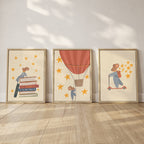 Storybook mouse wall art set featuring a mouse on a scooter, a mouse sitting on books, and a mouse in a hot air balloon with starry details
