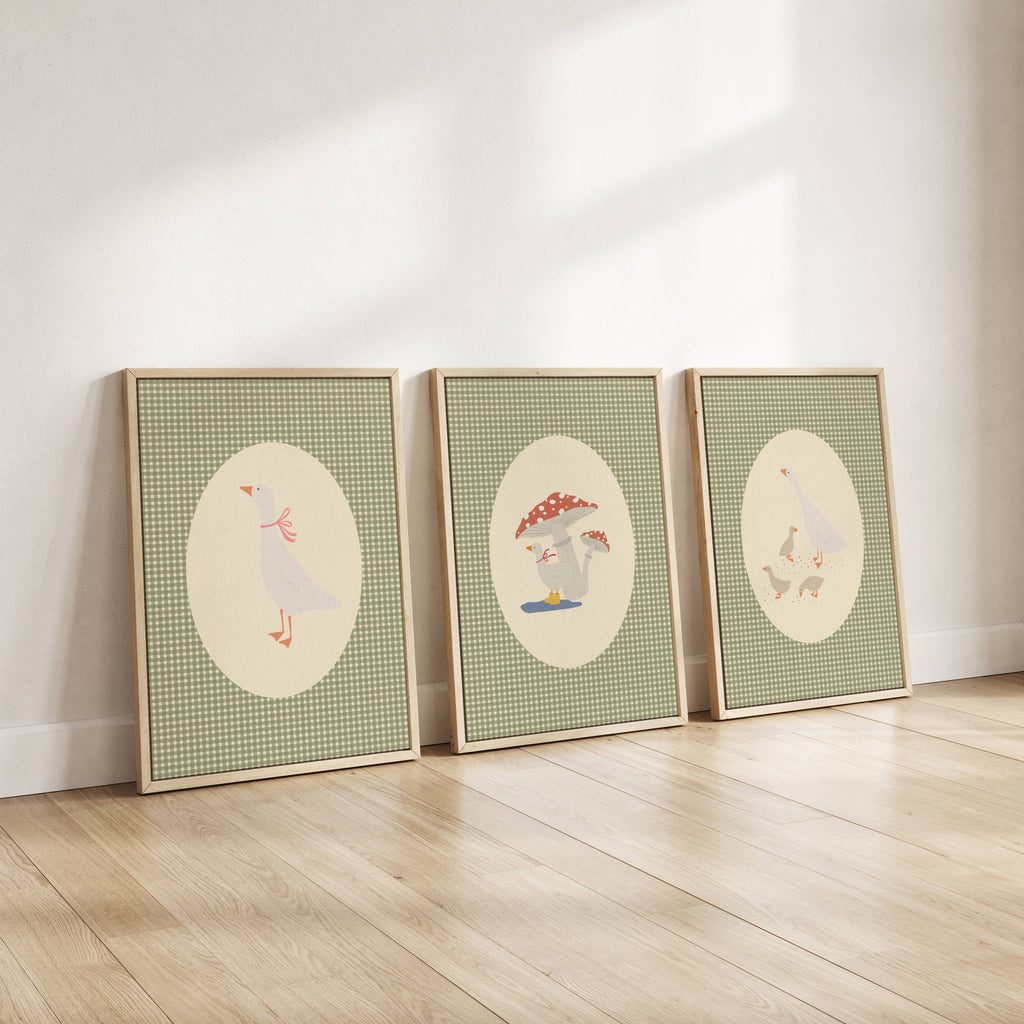 Set of three matching children’s posters featuring cute duck illustrations in oval frames on a green gingham background, in a soft classic style