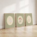 Set of three matching children’s posters featuring cute duck illustrations in oval frames on a green gingham background, in a soft classic style