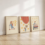 Storybook mouse wall art set featuring a mouse on a scooter, a mouse sitting on books, and a mouse in a hot air balloon with starry details